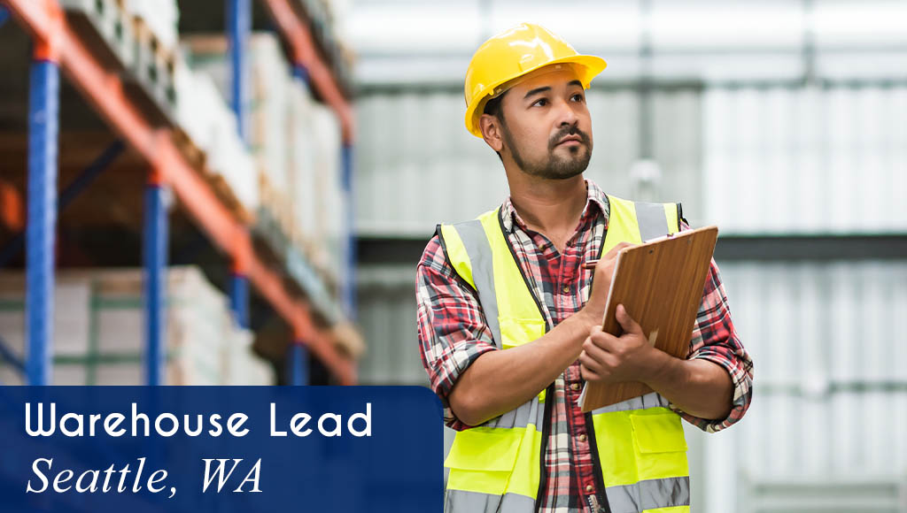 Image shows a man wearing safety gear and writing on a clipboard in a warehouse environment. Now Hiring a Warehouse Lead in Seattle, WA. All StarZ Staffing.