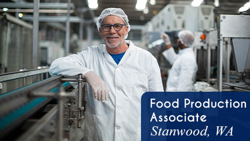 Image shows a man wearing a hair net smiling and working on a food production line. Text reads: Now hiring a Food Production Associate in Stanwood, WA. All StarZ Staffing.