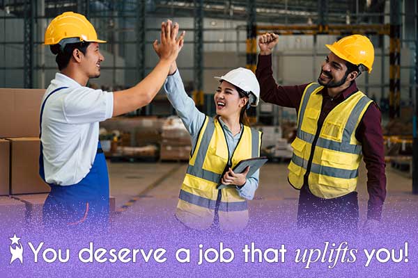 Three warehouse employees wearing safety vests and hard hats celebrate with smiles. Two are high-fiving, and one has his hand raised in celebration. White text at the bottom of the image reads: 'You deserve a job that uplifts you!'