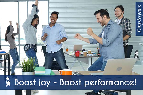 Diverse group of employees celebrating together in an open office, representing workplace happiness and team success. White text over blue section at bottom reads 'Boost joy - Boost productivity!' highlighting the connection between employee joy and productivity.