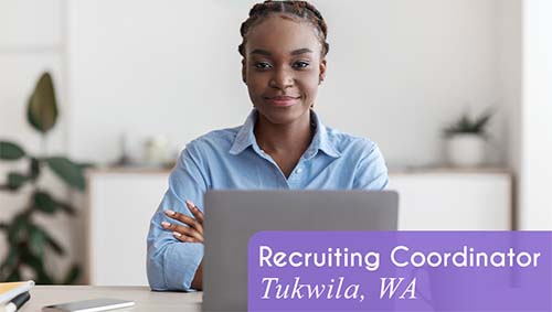 A woman smiles with a laptop at a desk in an office setting. White text over a purple banner reads: 'Recruiting Coordinator in Tukwila, WA. All StarZ is hiring!