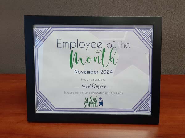 Framed Employee of the Month certificate, celebrating Tadd for his outstanding performance at All StarZ Staffing.